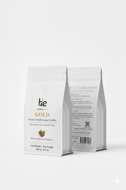 Front and back view of Humaneast Gold Instant Coffee packaging – premium matte white pouch with gold branding.