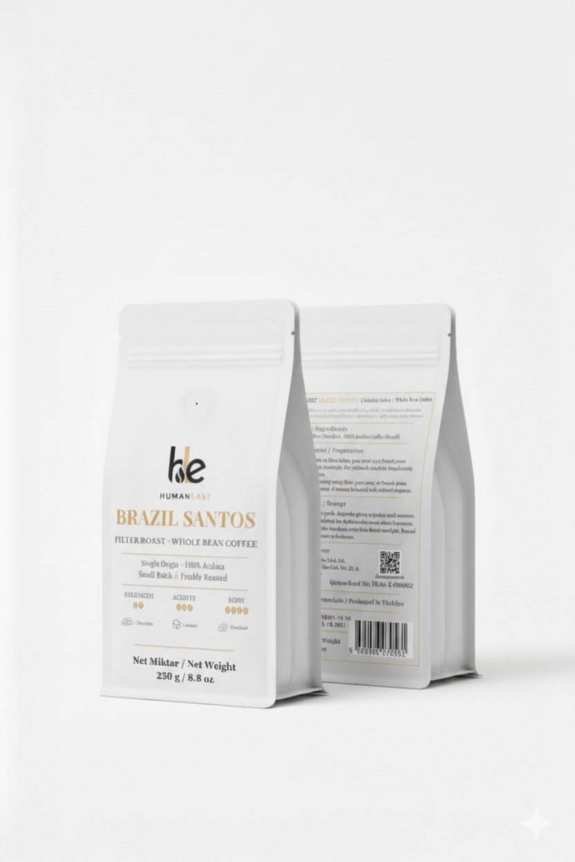 Humaneast Single Origin Brazil Santos 250 g front and back packaging — premium matte white pouch with gold accents.